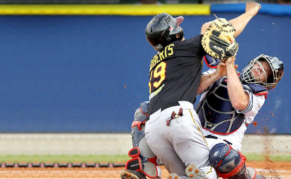Joshua Roberts, left, of the Brisbane Bandits collides with Melbourne Aces catcher Scott Wearne as he attempts to get home during an Australian Baseball League encounter at the Melbourne Showgrounds last summer. Joshua Roberts, left, of the Brisbane Bandits collides with Melbourne Aces catcher Scott Wearne as he attempts to get home during an Australian Baseball League encounter at the Melbourne Showgrounds last summer.
